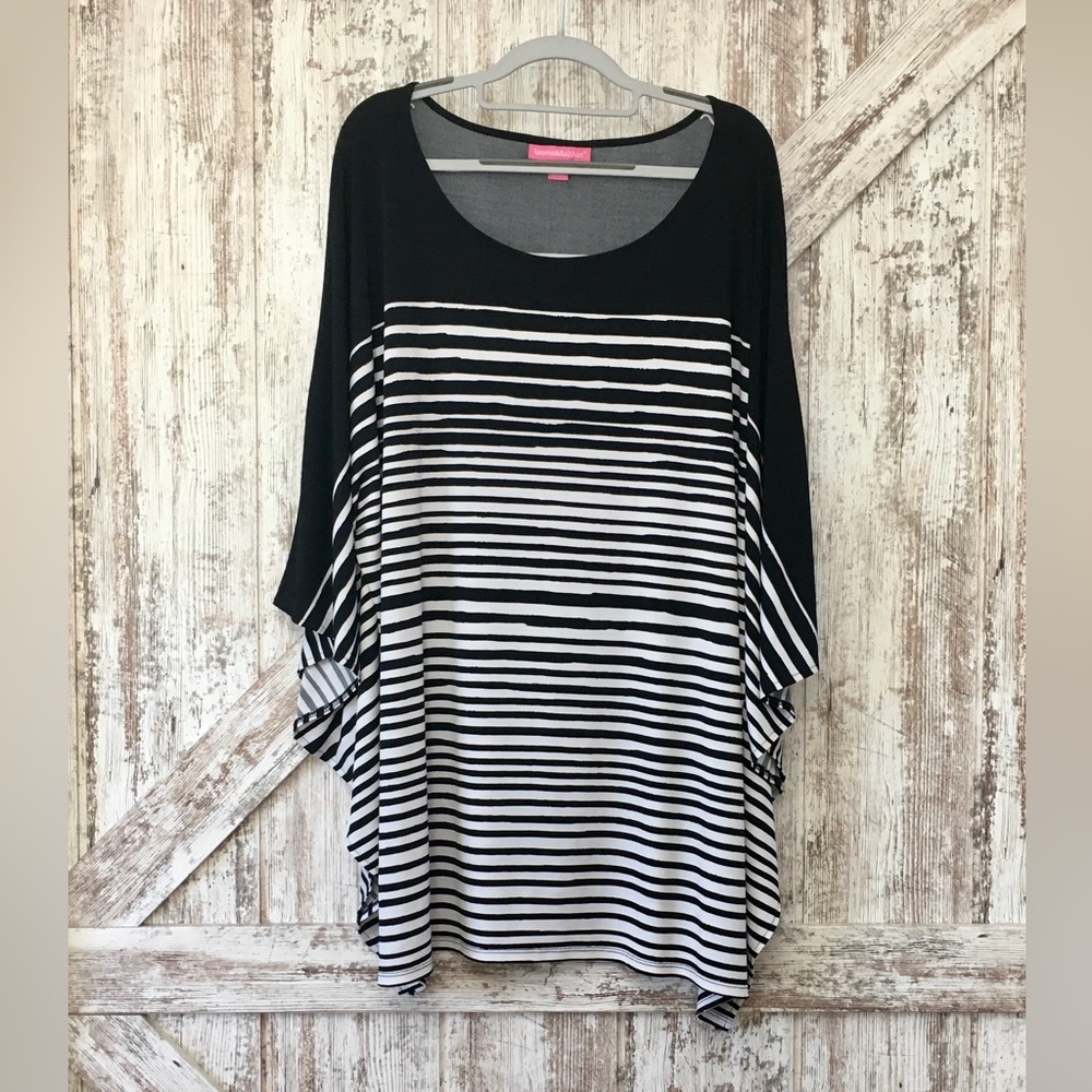 Woman Within Black and White Striped Tunic Poncho